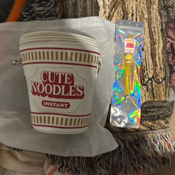 Brand new cute noodle’s crossbody with strap. - Picture 1 of 3